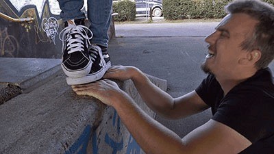 Hands Trampled Under Vans In The Skate Park